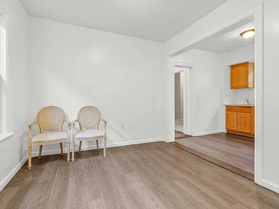 Chairs Inside the Room View of Single Family Home for Sale in 7-06 College Point, NY 11356