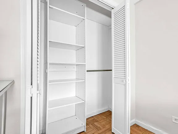 Cupboard View of co-op apartment building at 21050 41st Ave Apt 1C in Flushing, NY