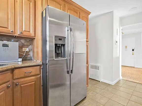 Kitchen Fridge View of co-op apartment building at 21050 41st Ave Apt 1C in Flushing, NY
