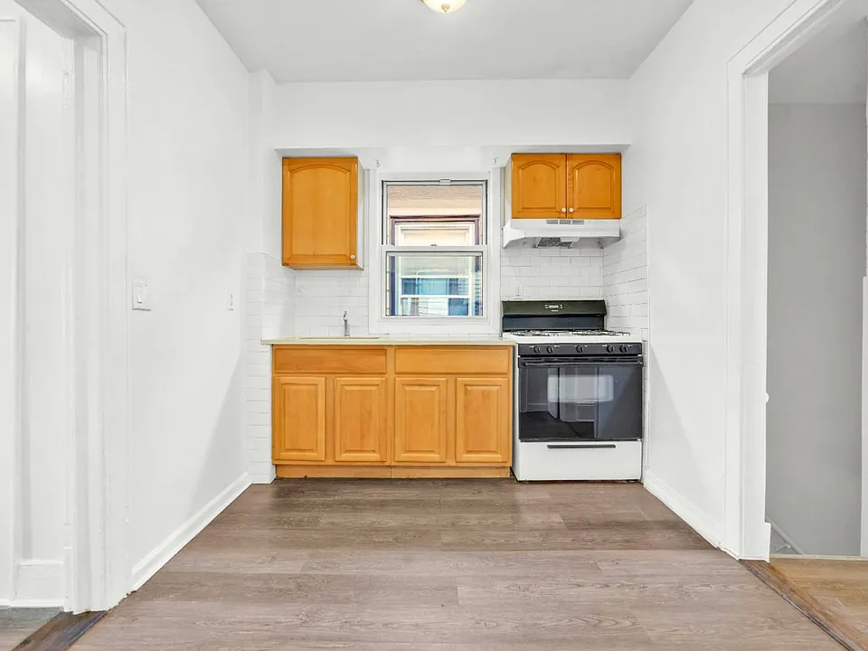 Kitchen View from Front of Single Family Home for Sale in 7-06 College Point, NY 11356