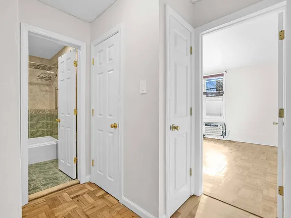 Washroom doors inside co-op apartment at 21050 41st Ave Apt 1C in Flushing, NY