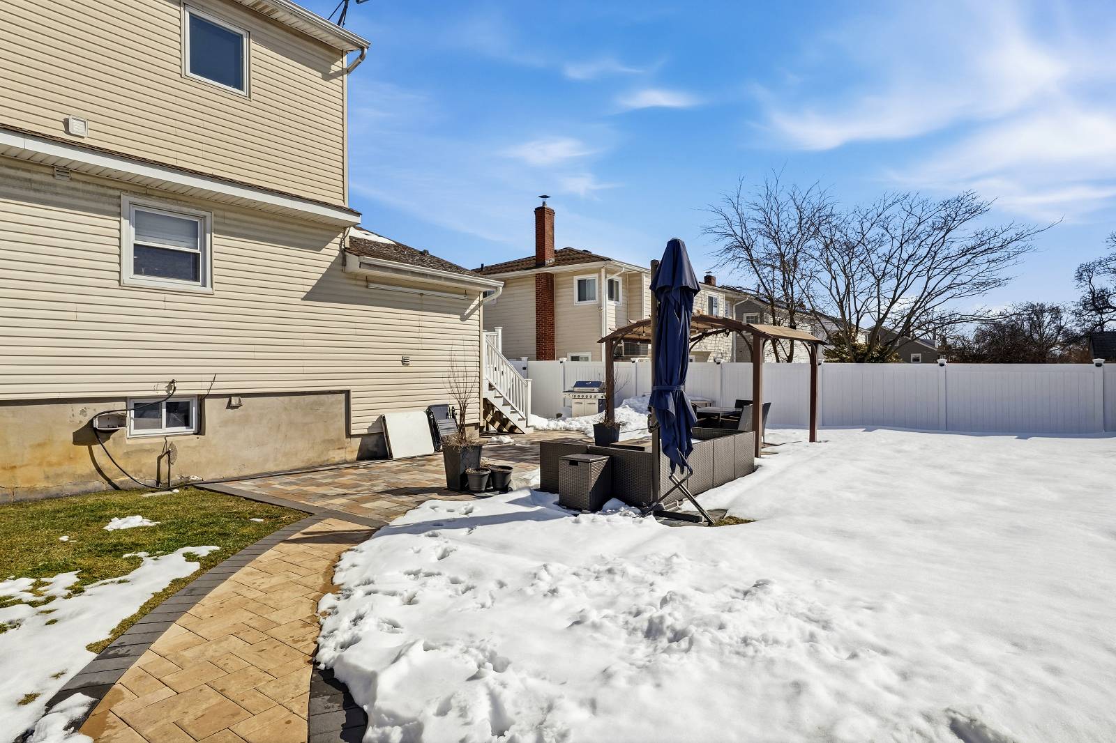 House for Sale in Freeport NY – Outside view in snowfall