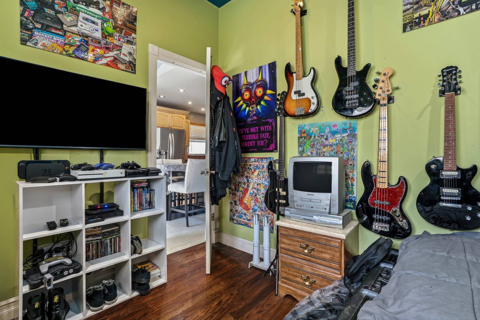 House for Sale in Freeport NY – Upstairs room with guitars and tv